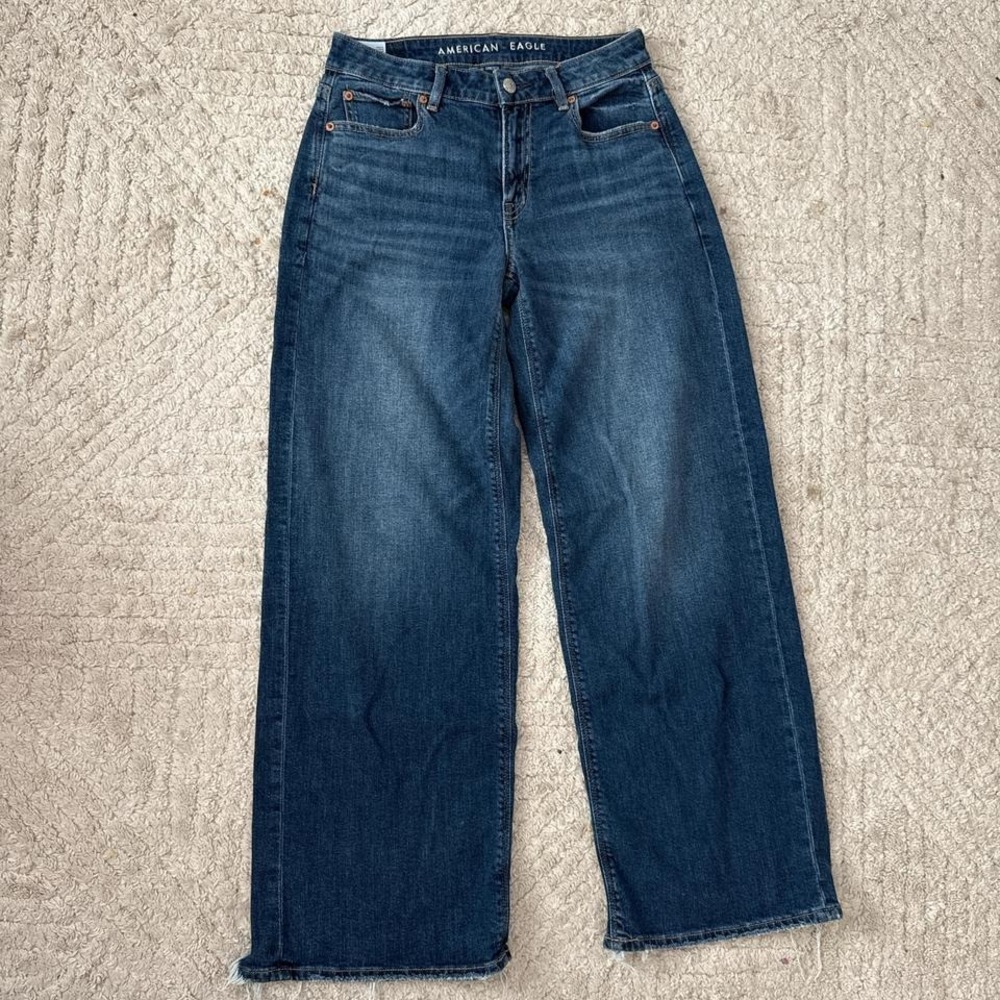 American Eagle low rise baggy wide leg dark wash distressed bottom hem jeans
